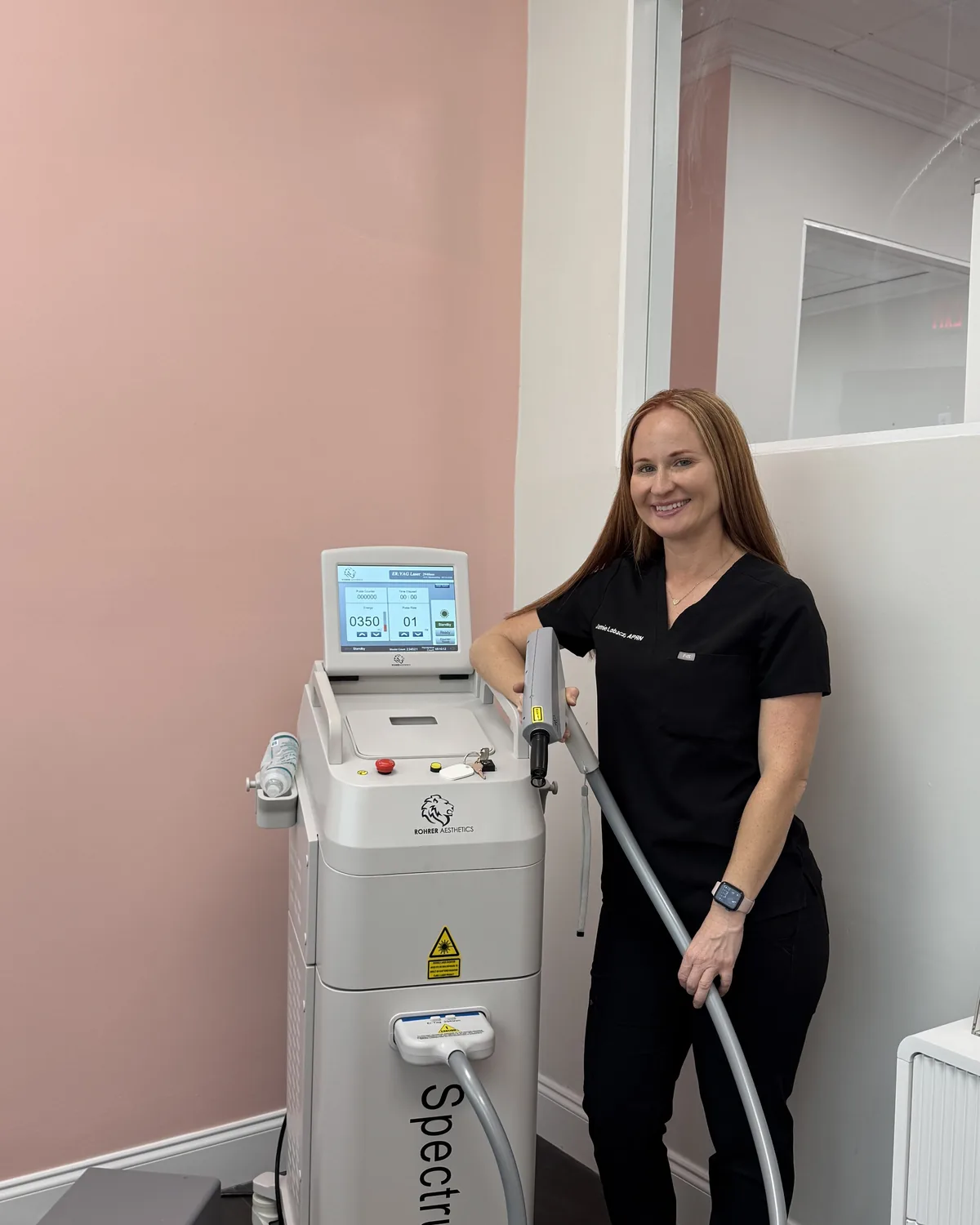 Jamie Lobacz, APRN, with the Spectrum laser platform at The Ginger Injector, Boca Raton